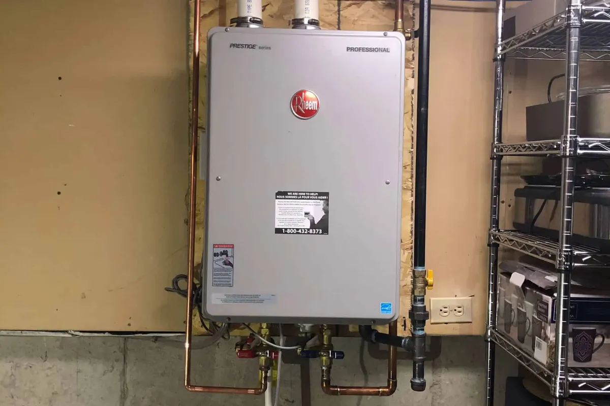 Rheem tankless water heater installed on a wall in a Toronto basement