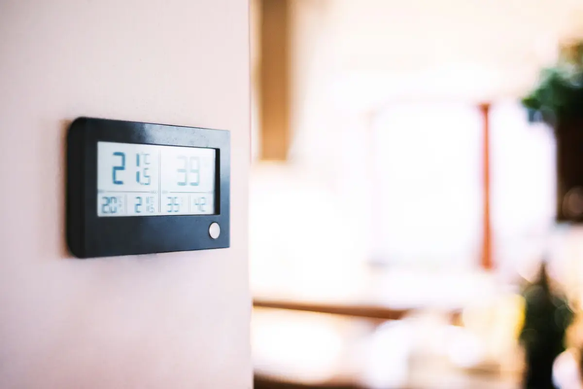 Modern smart thermostat on a residential wall in Toronto